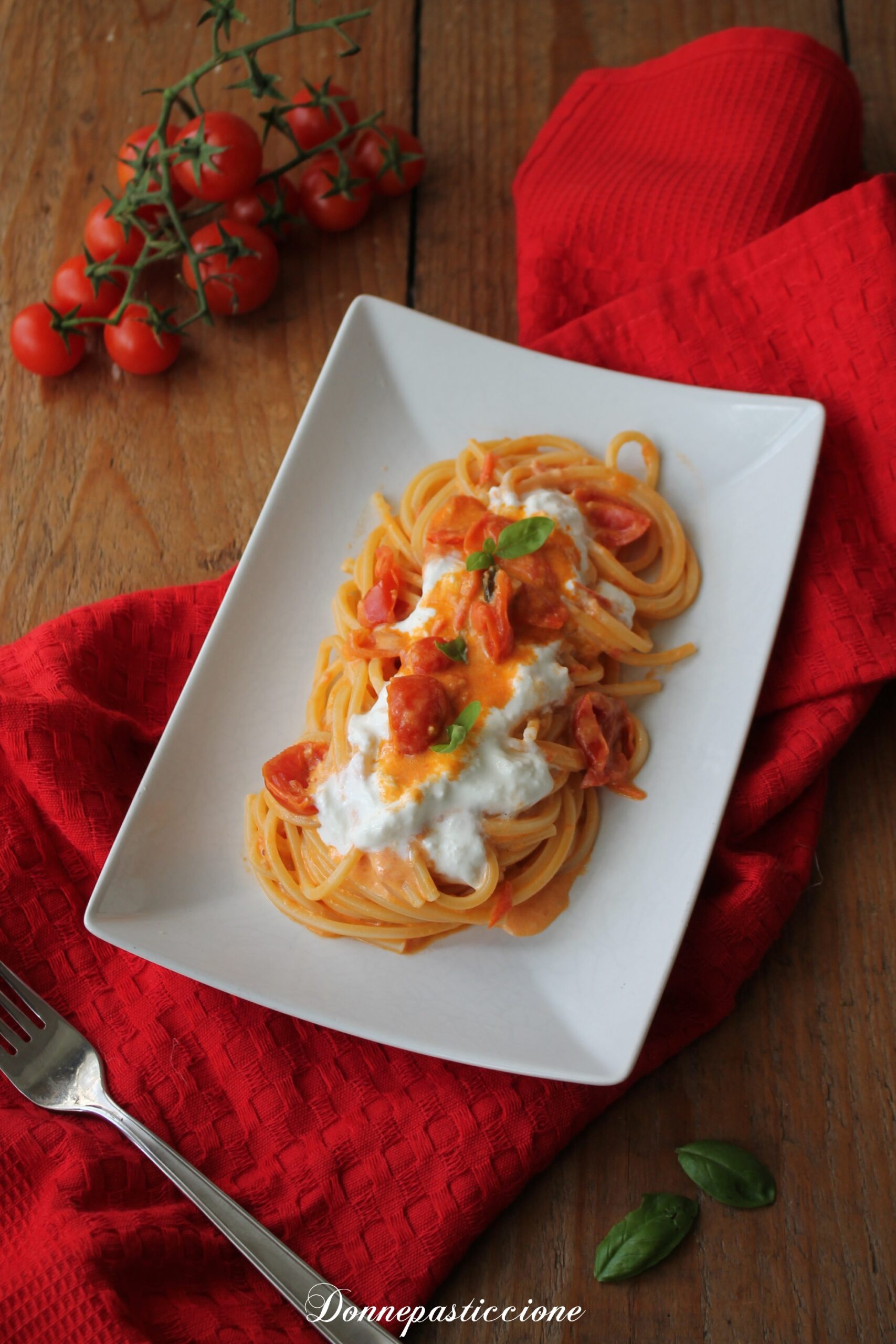 Spaghetti al pomodoro confit, burrata e basilico